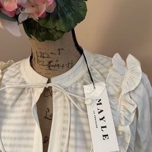 Designer cotton blouse with ruffle details.